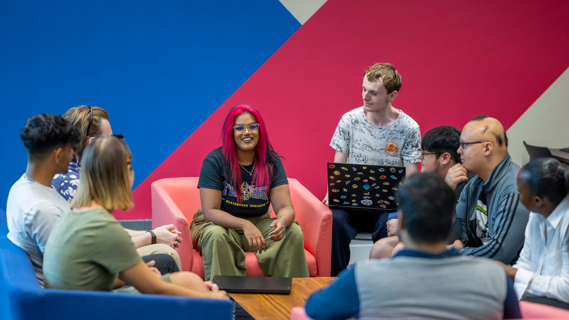 Cardiff School of Technologies students sat around a coffee table in discussion