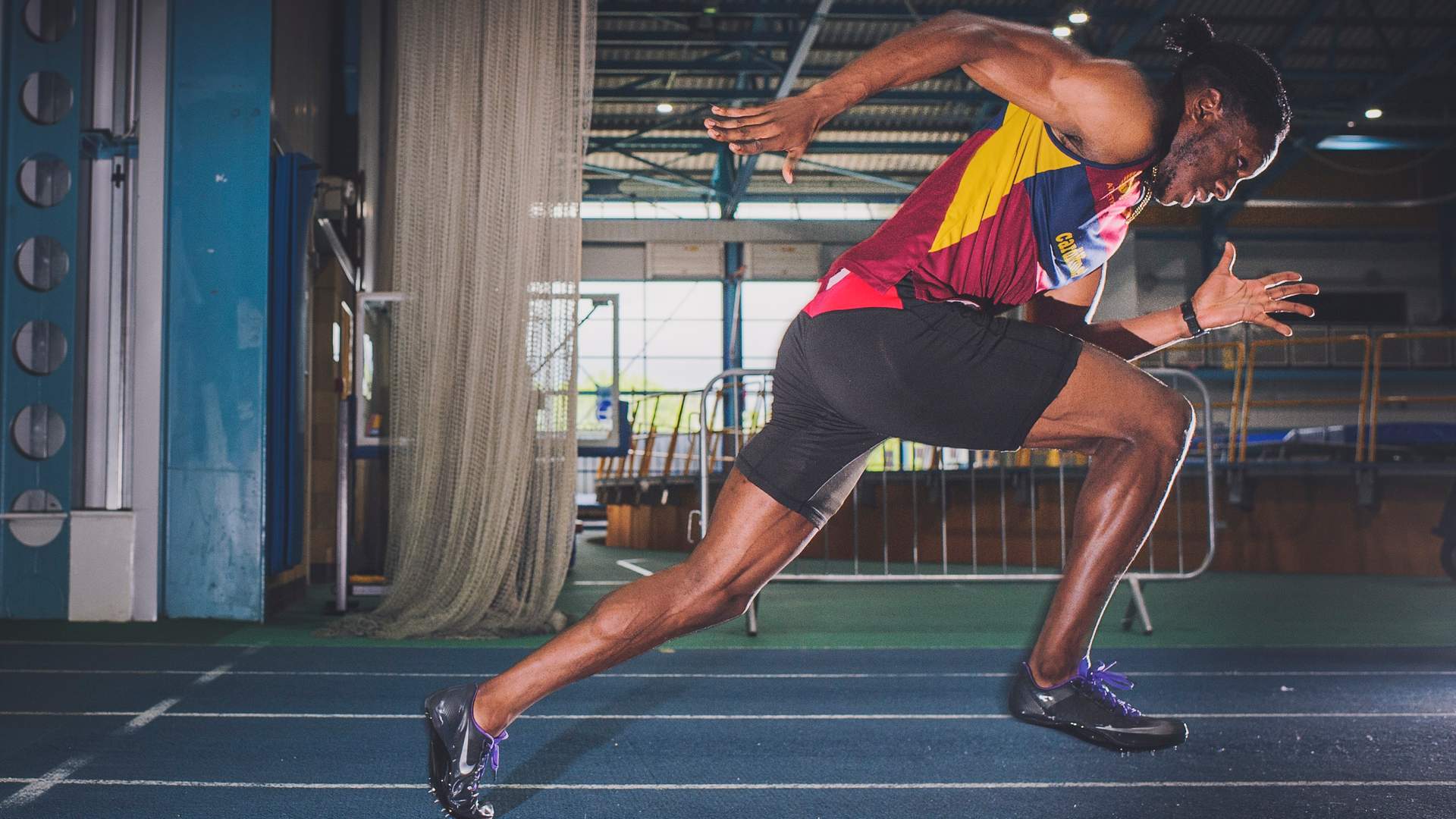Side view of sprinter running on a track
