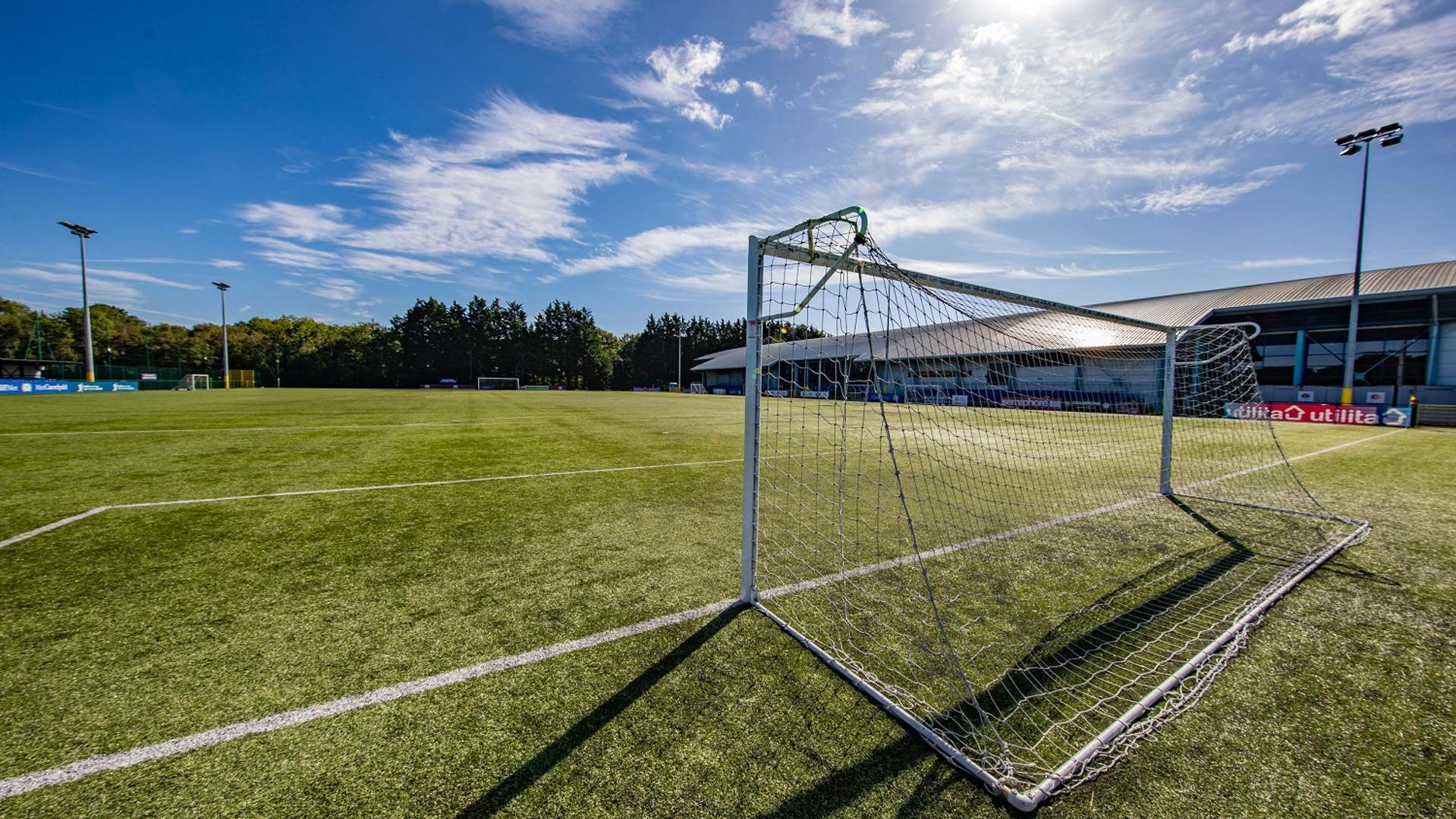 A view from behind one of the goals on the 3G football pitch on a sunny day