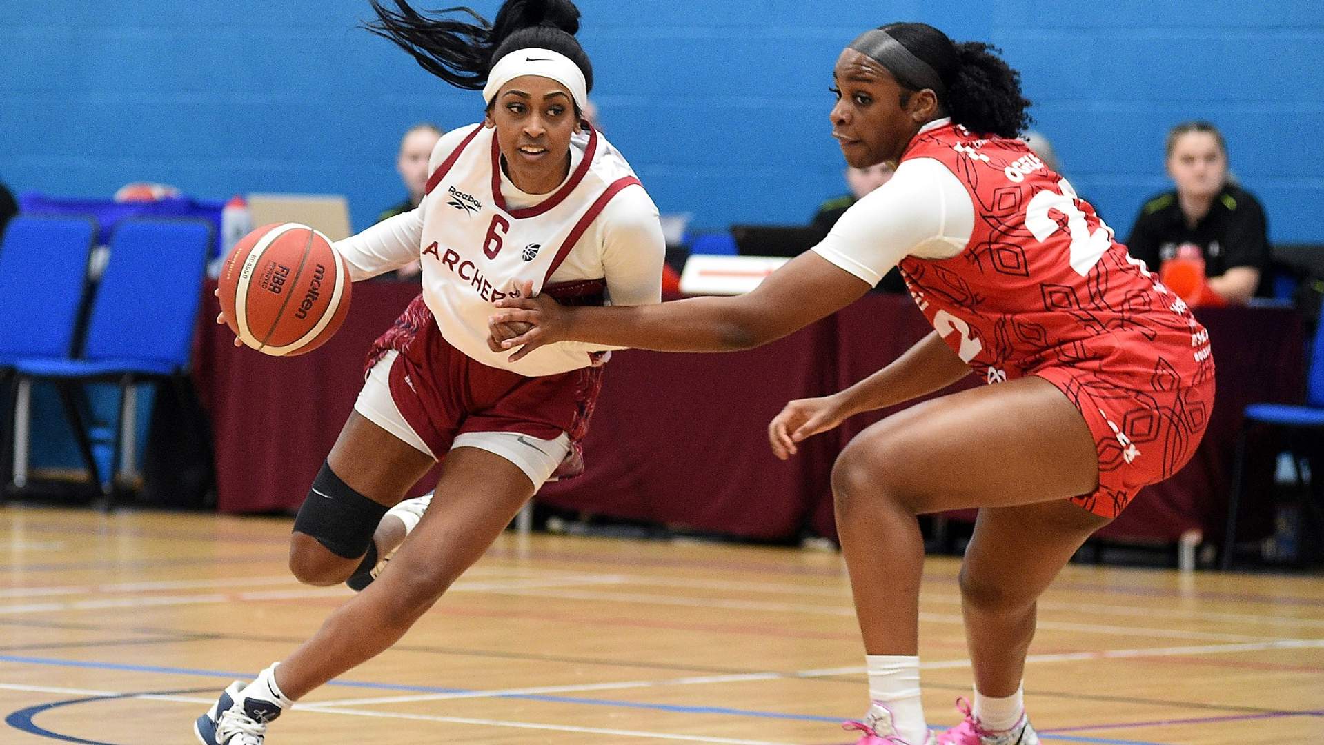 Cardiff Met Archers student player dribbles with a basketball against an opponent