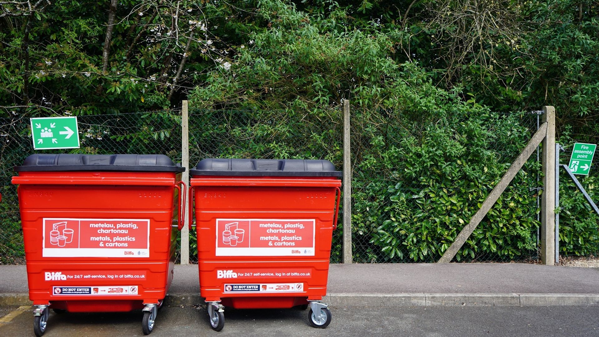 Large red waste bins on Cardiff Metropolitan University campus