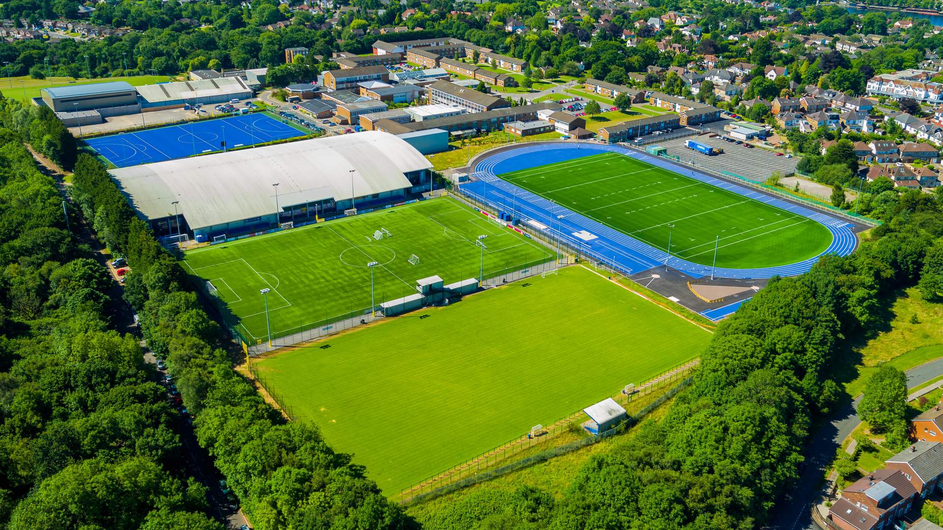 Aerial view of the Cyncoed Campus, featuring several sports pitches and a running track