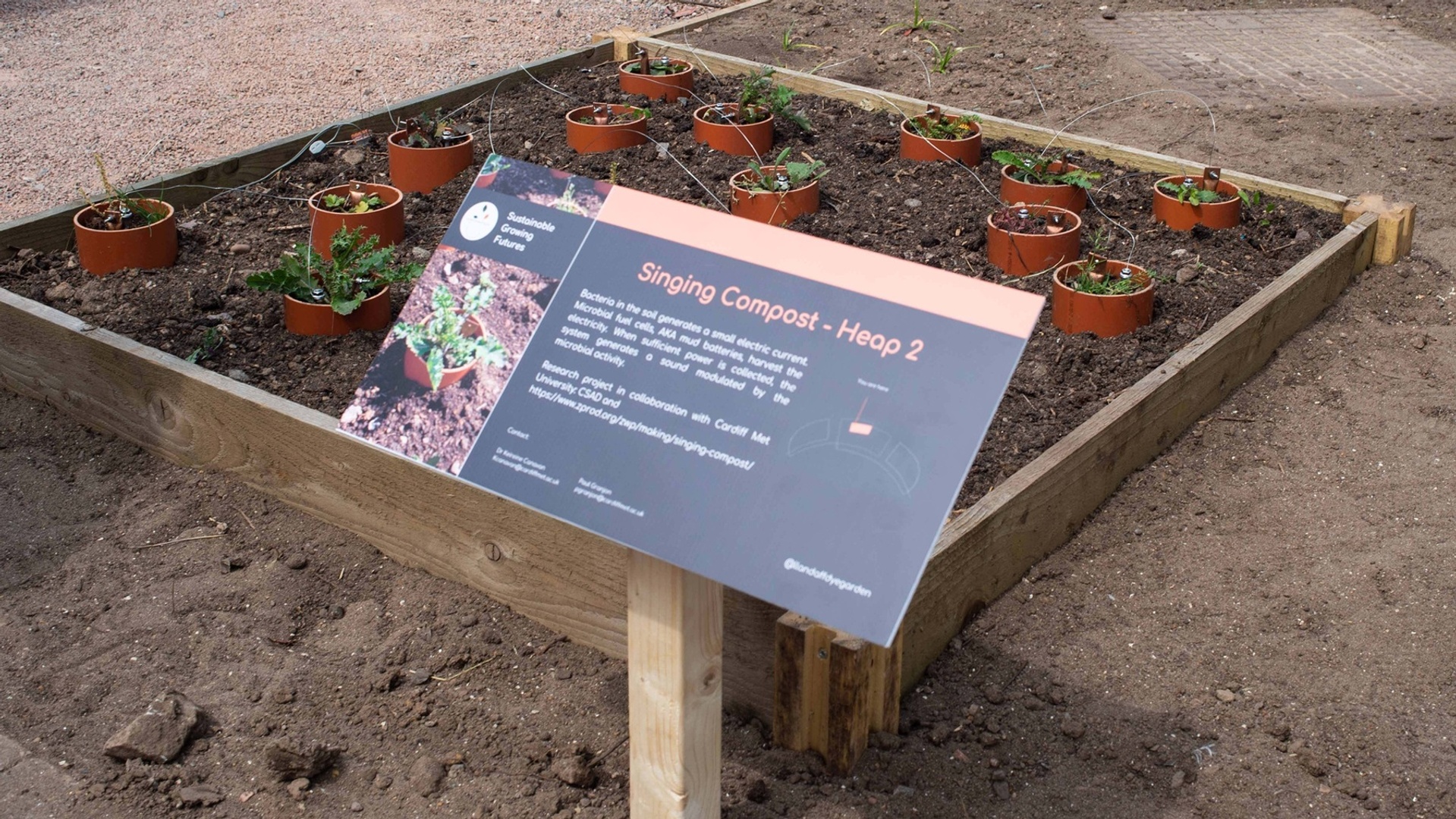 Information sign in front of a plant bed