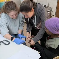 In a hospital, two women collaborate on patient care, showcasing their dedication to health and well-being.