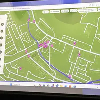 A digital map displaying the layout and streets of a city, with various landmarks marked for navigation.