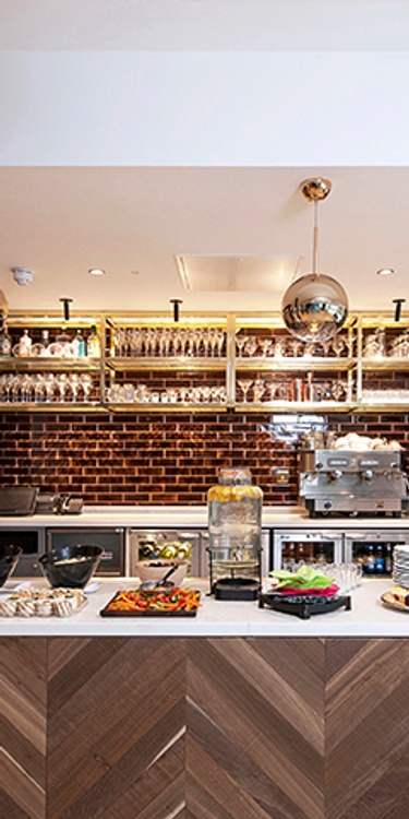 A spread of fresh food on display in front of a drinks bar