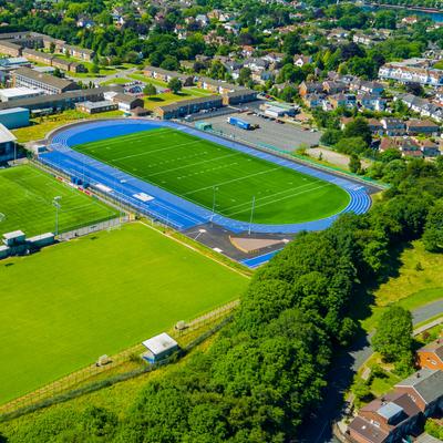 Aerial view of the Cyncoed Campus, featuring several sports pitches and a running track