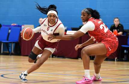 Cardiff Met Archers student player dribbles with a basketball against an opponent