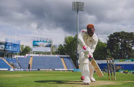 A Cardiff Met cricket player aims to strike the ball with their bat
