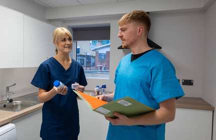 Nutrition Dietetics lecturer with student in Allied Clinical Health Hub kitchen