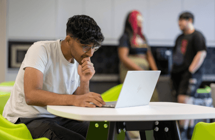 Student working from their laptop