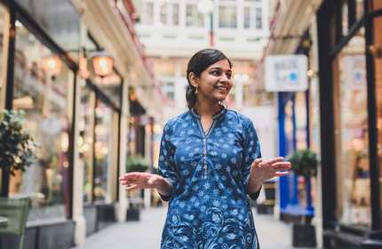 Manasi Parad stands in one of the indoor shopping arcades in the Cardiff city centre