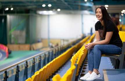 Dione Rose sat alone in the tiered seating stand at the National Indoor Athletics Centre