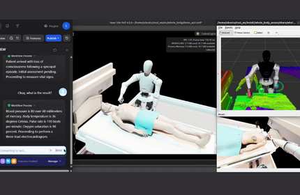 A screen showing computer generated images of a robot interacting with a patient on a hospital bed.