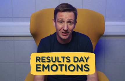 A man sits on a yellow chair with the text 'Results Day Emotions' in front of them