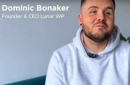 Image of Dominic Bonaker, founder and CEO, smiling confidently in a professional setting.