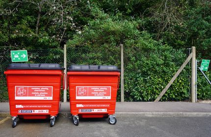 Large red waste bins on Cardiff Metropolitan University campus