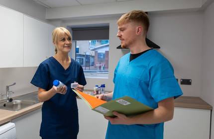Nutrition Dietetics lecturer with student in Allied Clinical Health Hub kitchen
