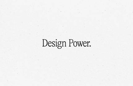 'Design Power.' text on a white marble background