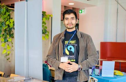 A young man wearing a Support Fairtrade t-shirt.