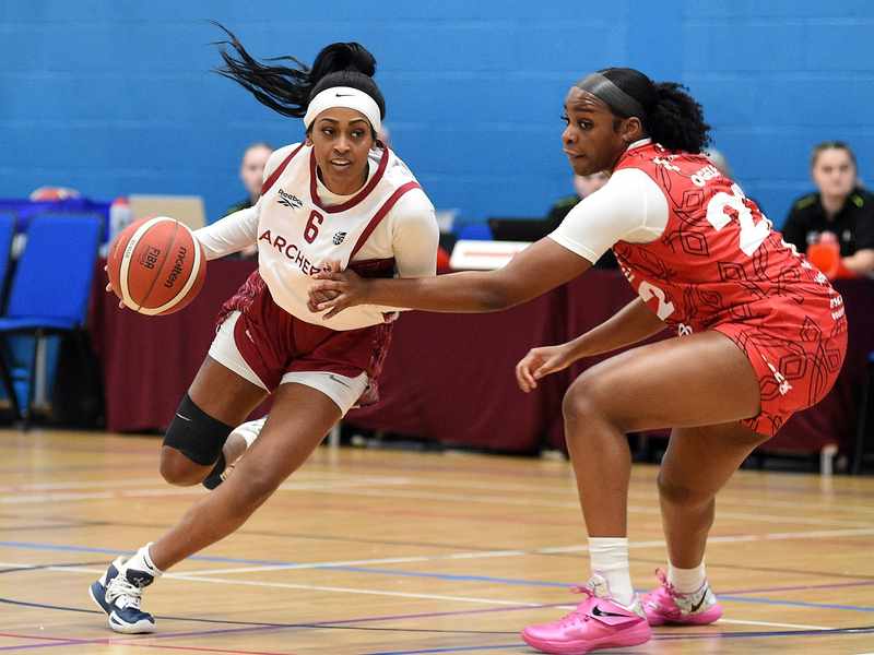 Cardiff Met Archers student player dribbles with a basketball against an opponent