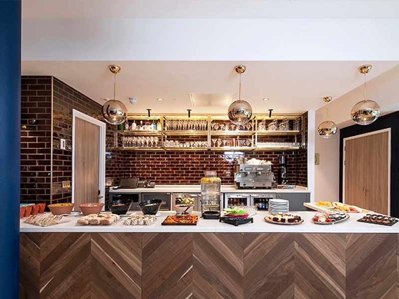 A spread of fresh food on display in front of a drinks bar