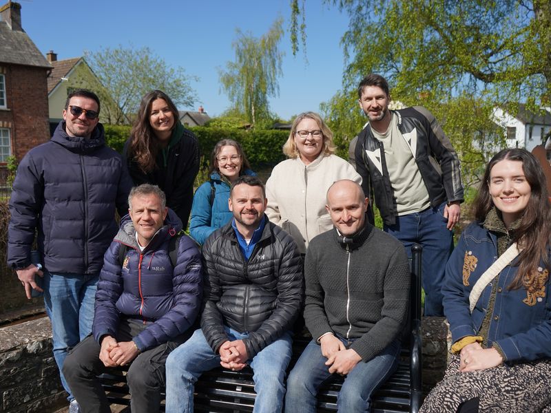 The Sustainability team pose for a photograph on a sunny day