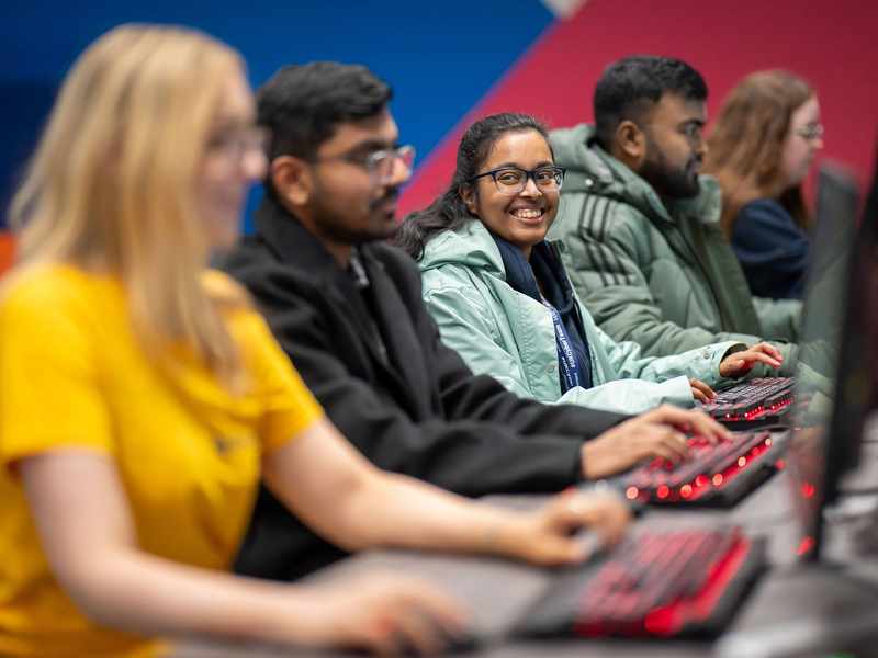 Group of students using computer workstations