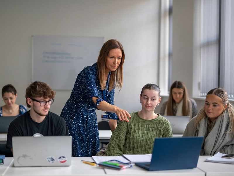 Social Work lecturer with students