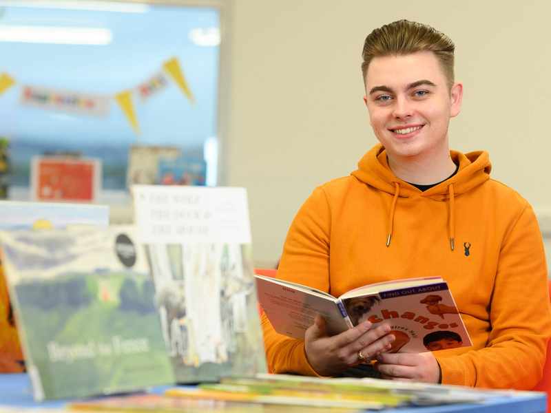 Student with primary school textbooks