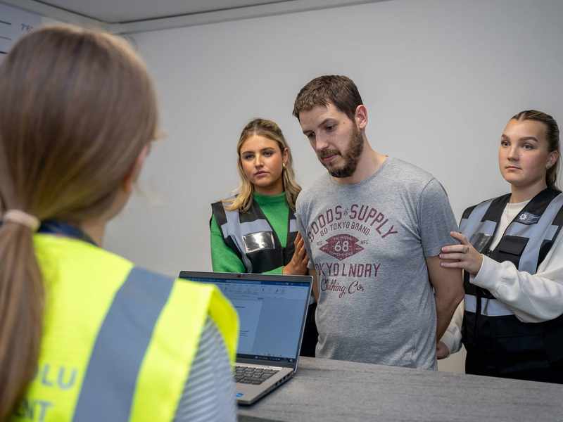 Students in Crime House custody suite