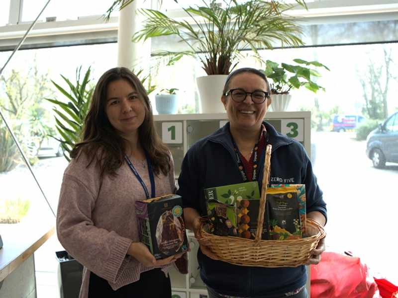 Two women holding Fairtrade-branded foods