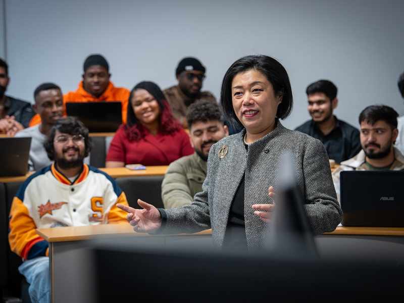 MSc International Business Management lecturer talks to a classroom of students