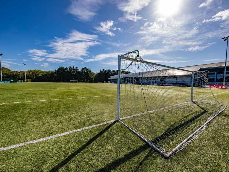 A view from behind one of the goals on the 3G football pitch on a sunny day