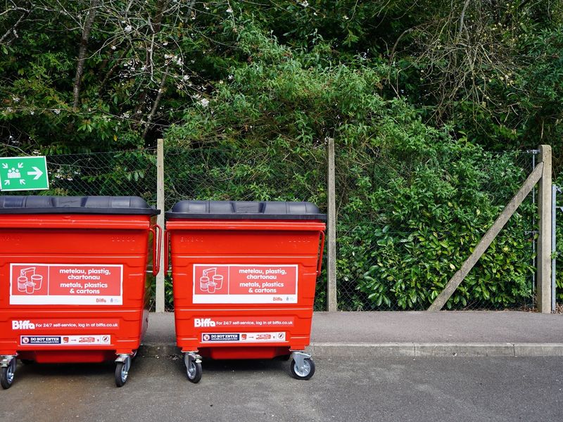 Large red waste bins on Cardiff Metropolitan University campus