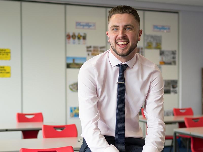 Student teacher photographed in their classroom