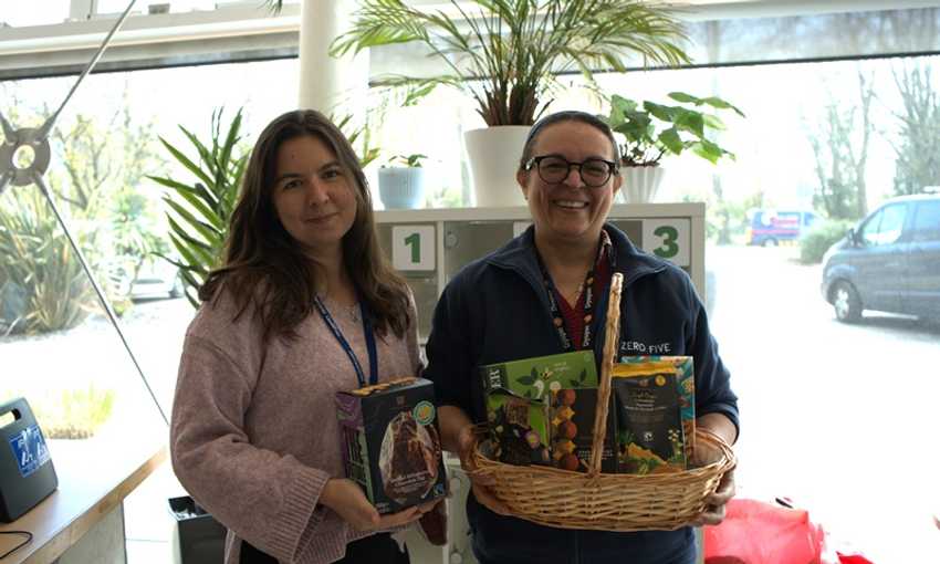 Two women holding Fairtrade-branded foods