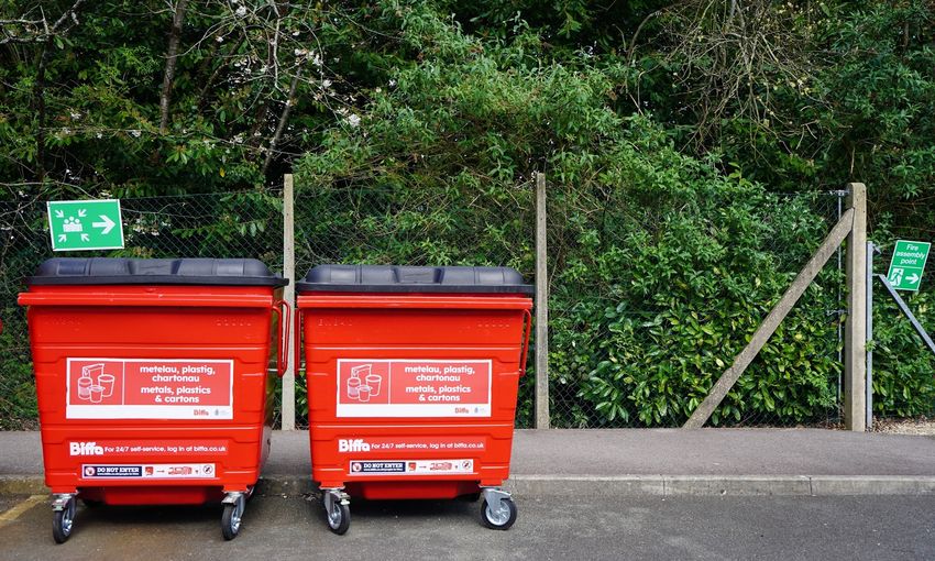 Large red waste bins on Cardiff Metropolitan University campus