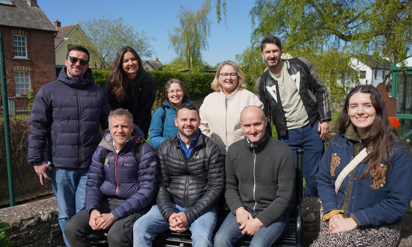 The Sustainability team pose for a photograph on a sunny day