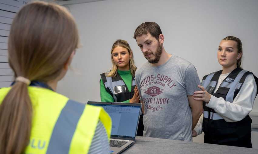 Students in Crime House custody suite