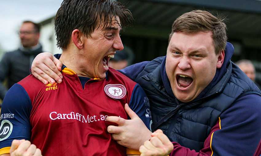 Player and Coach of Cardiff Metropolitan University FC celebrate together