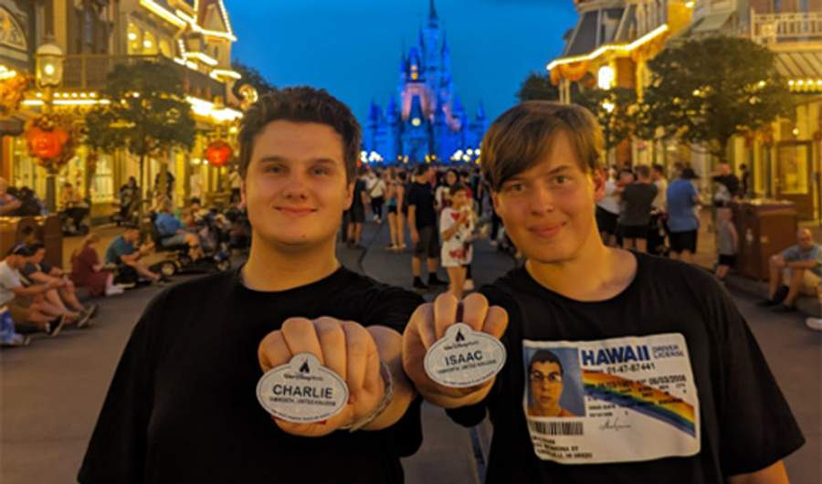 Two people at a Disney theme park.
