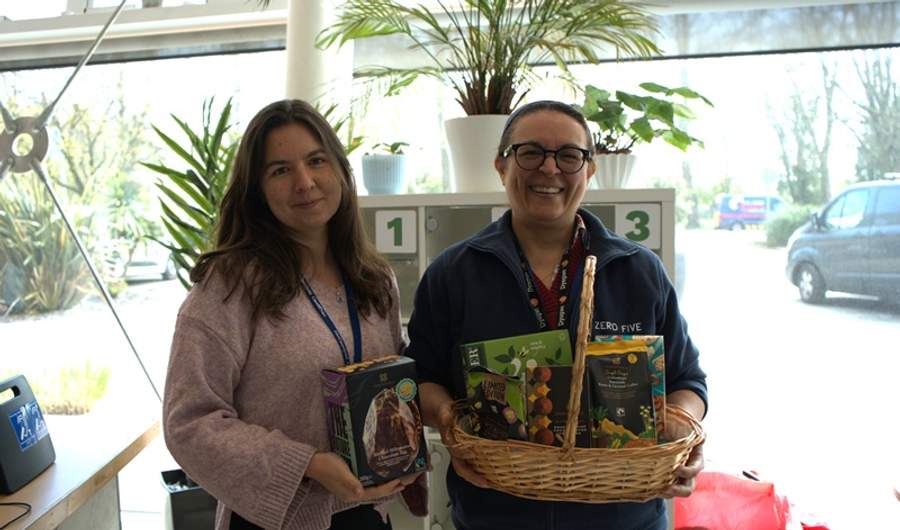 Two women holding Fairtrade-branded foods