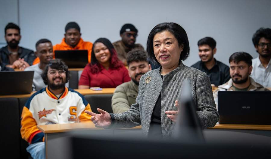 MSc International Business Management lecturer talks to a classroom of students