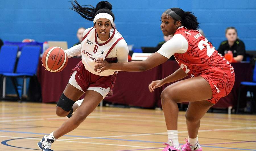 Cardiff Met Archers student player dribbles with a basketball against an opponent