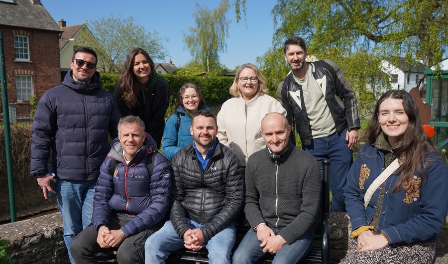 The Sustainability team pose for a photograph on a sunny day