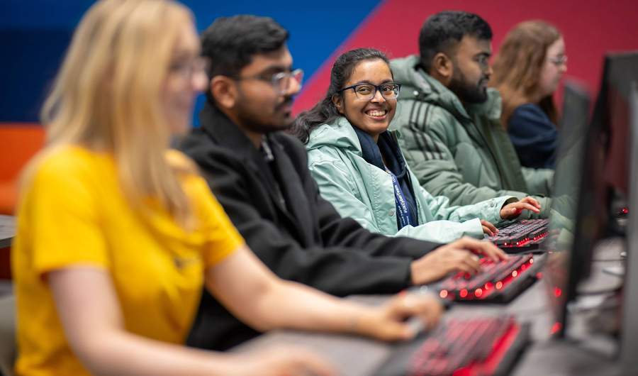 Group of students using computer workstations