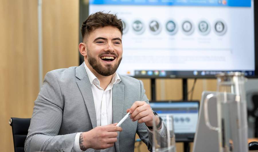 Law student sat at desk in Moot Courtoom