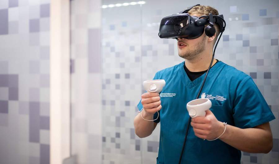 Student using VR headset in Allied Clinical Health Hub