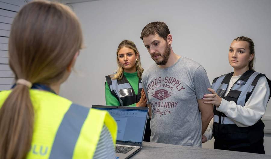 Students in Crime House custody suite